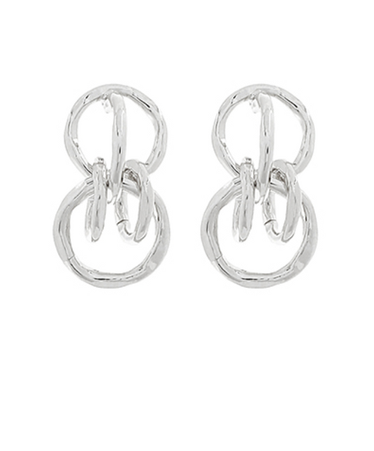 Modern Sculptural Knot Studs in polished silver-toned metal, featuring an abstract, intertwined loop design.