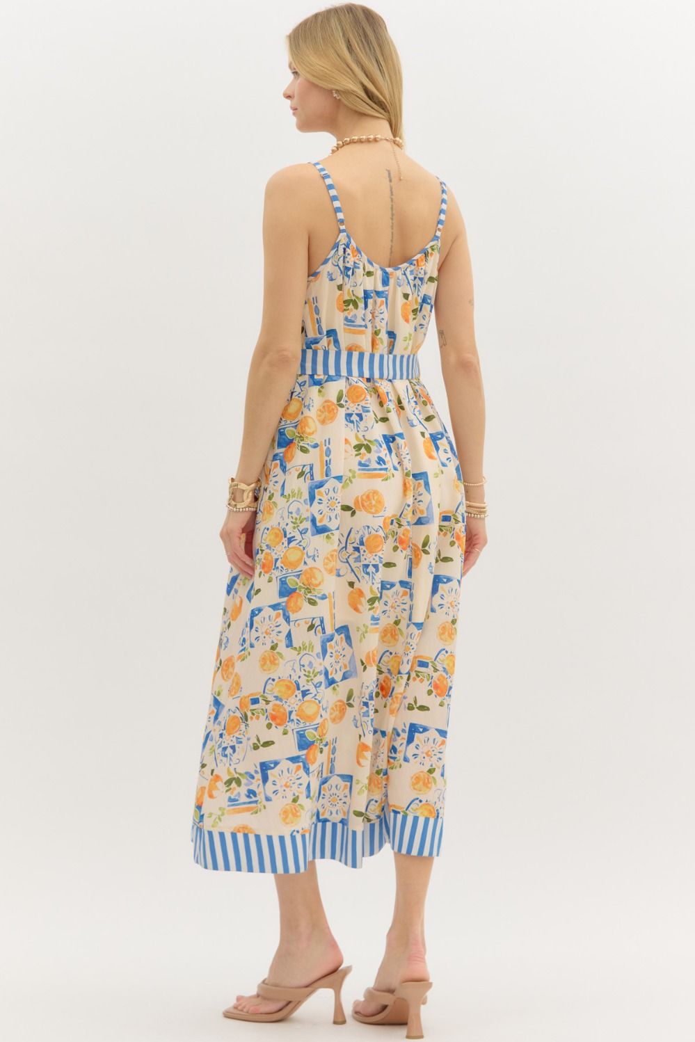 Multi-print adjustable shoulder strap pullover midi dress featuring stripe contrast accent. Removable tie at waist. Pockets at sides. Lined. Woven. Non-sheer. Lightweight.