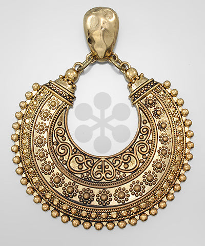 Ornate antique gold crescent tribal pendant with detailed engraving and dotted edge design.