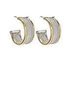 Two-tone gold and silver hoop earrings featuring pave crystal detailing, designed for a bold yet sophisticated look