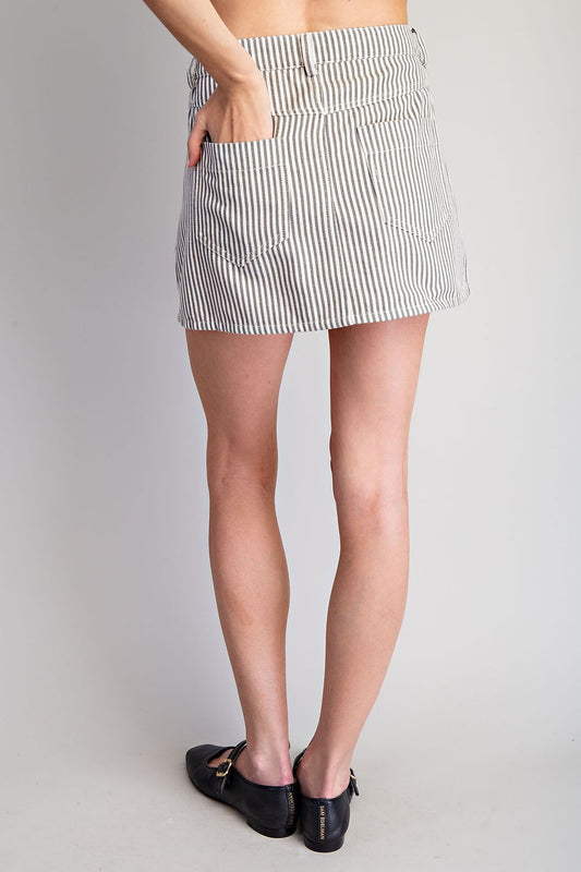 The Coralie Striped Wrap Mini Skirt blends playful stripes with structured everyday style.