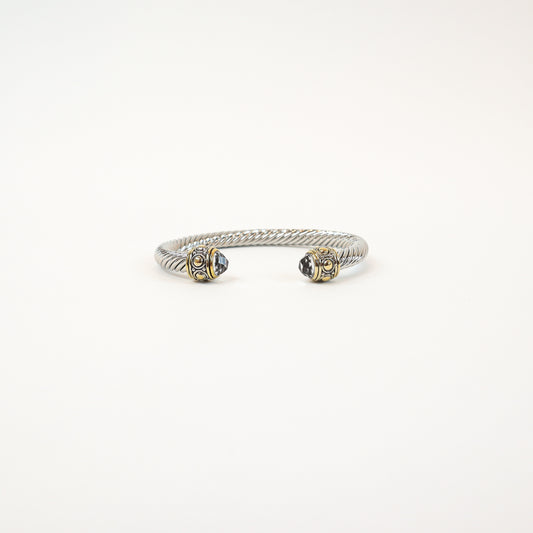 Elegant twisted cuff with intricate detailing