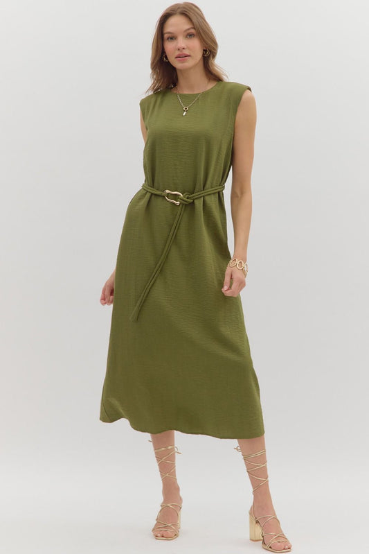 Solid muscle shoulder slit hem midi dress featuring embellished gold accent fastner belt. Single button keyhole closure at back neck. Lined. Woven. Non-sheer. Lightweight.
