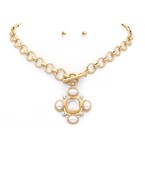 Elegant gold-tone statement necklace featuring a bold chain and a pearl and crystal centerpiece, paired with simple pearl stud earrings for a classy and coordinated look.