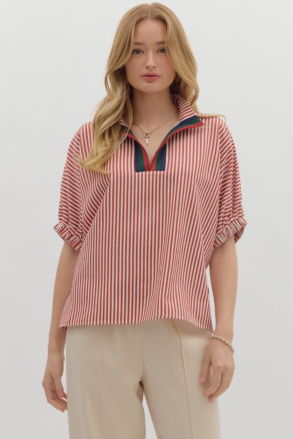 Striped dolman sleeve pullover with multicolor ribbed neck detail.