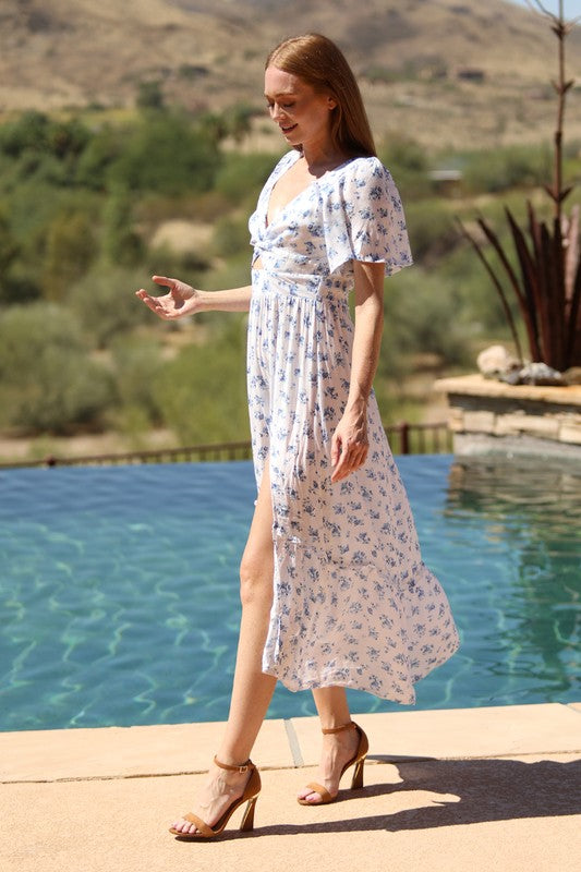 blue floral maxi dress with flutter sleeves and a front slit