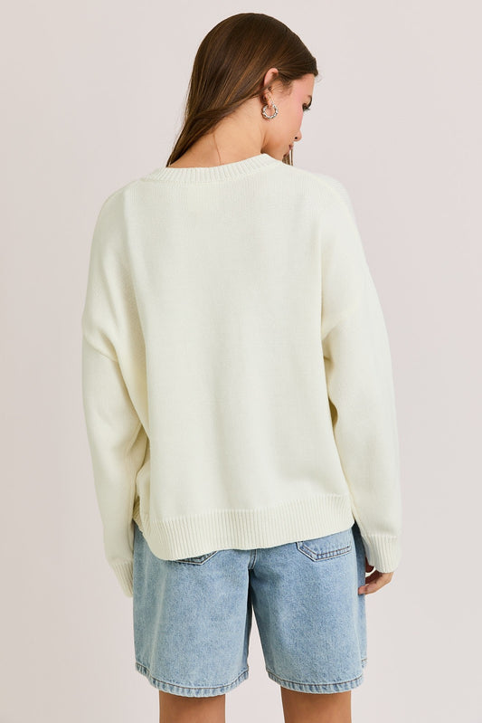 The Bernice Cardigan features a bold horse graphic design with a cozy knit blend, round neckline, and long sleeves for effortless statement layering.