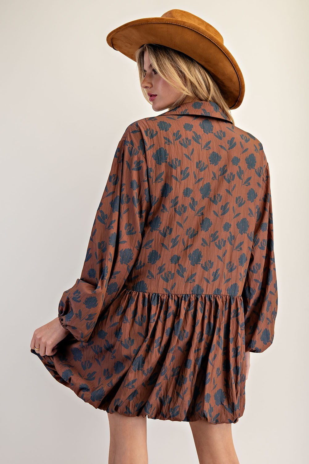 The Calista Printed Bubble Hem Dress blends playful volume with a lightweight floral design for a chic, standout look.