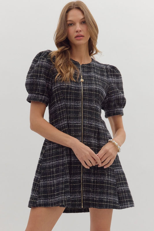 The Camille Plaid Mini Dress features playful short sleeves, a front zipper, and practical side pockets for versatile style.