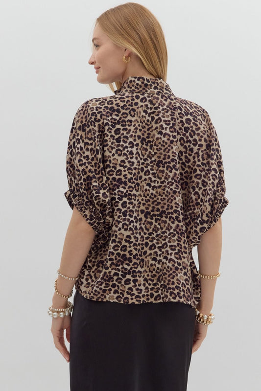 The Celeste Top brings bold energy to everyday style with a fierce leopard print, colorful ribbed split neckline, and breezy dolman sleeves.