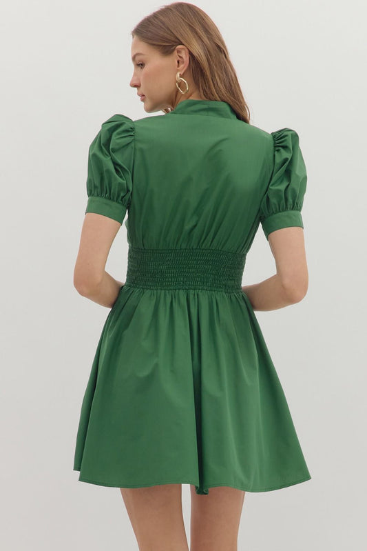 The Corrine Smocked Zip Mini Dress combines everyday ease with flattering structure, thanks to puff sleeves, a smocked waist, and front-zip detail.