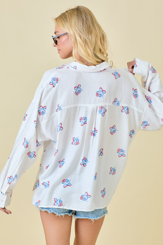 The Darlene Shirt brings bold charm to classic Americana style with cherry-red stripes, a timeless collared design, and an easy, relaxed fit.