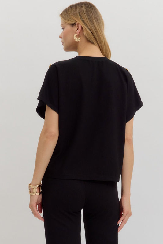 The Mabel Top is a classic crewneck pullover with a twist—featuring elegant gold button accents and a soft, lightweight knit for everyday ease and polish.