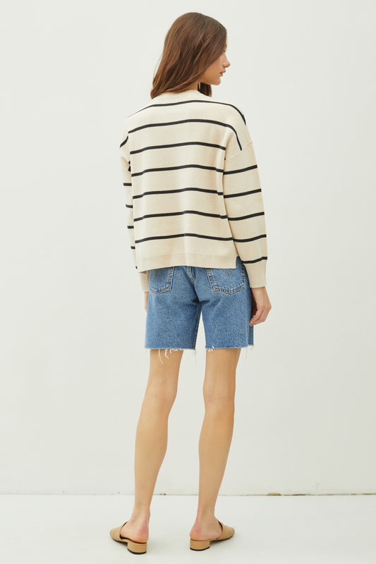 The Maxine Sweater is a cozy striped knit with a boxy oversized fit, stepped high-low hem, and casual-chic drop shoulders.