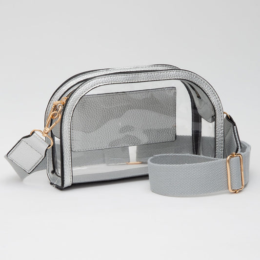 The Nadine Camera Bag combines sleek faux leather accents with a clear, compact design—perfect for game day and hands-free essentials.