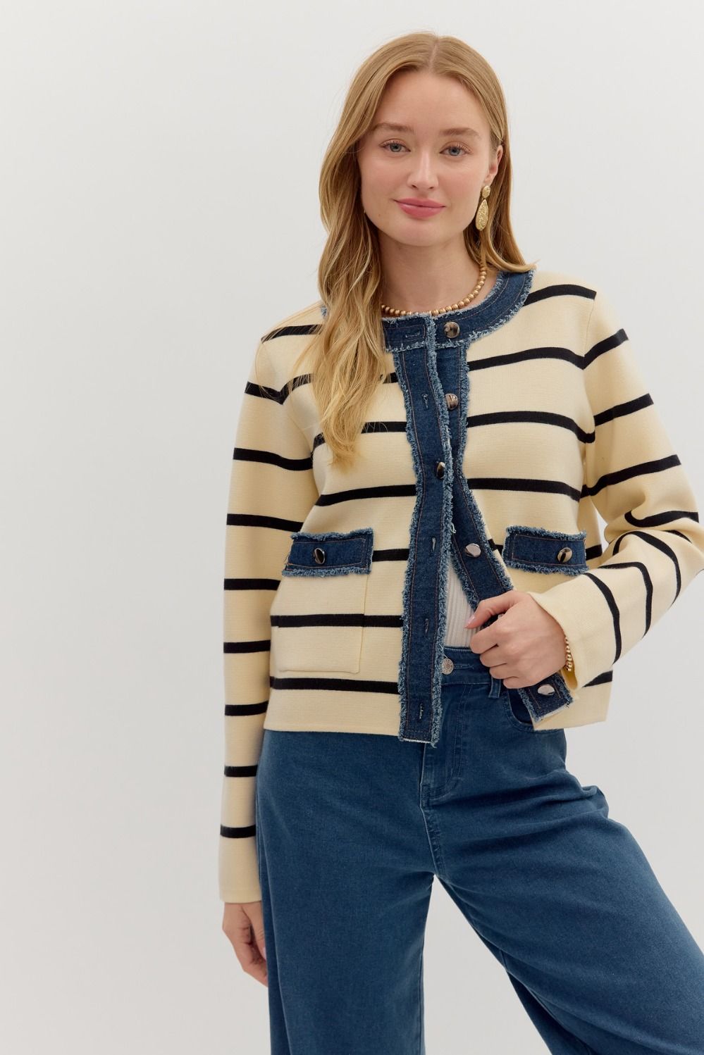 The Odessa Jacket blends cozy knit texture with structured denim contrast—featuring patch pockets, bold stripes, and timeless button-up style.