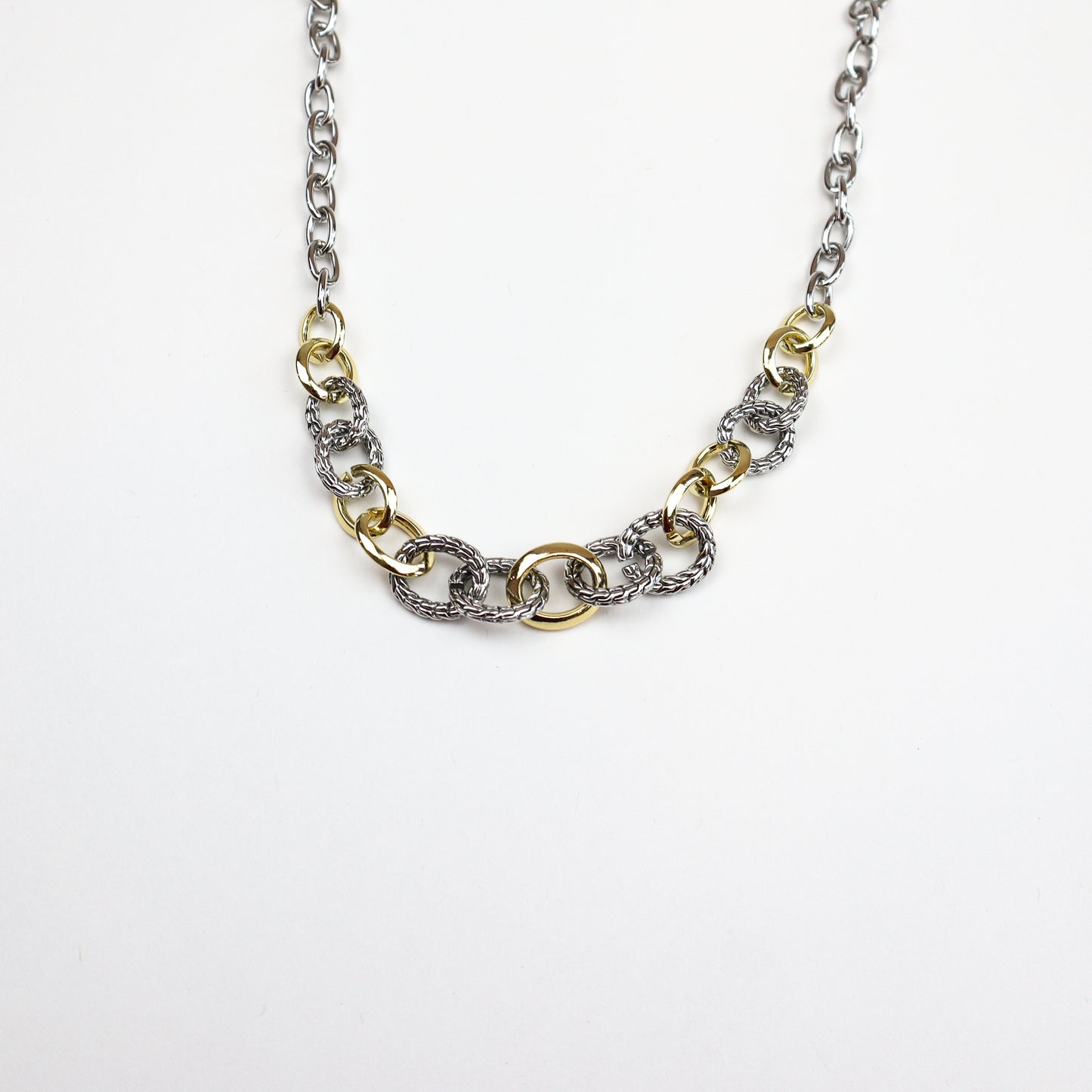 Elevate your everyday look with The Two-Toned Link Necklace—a sophisticated fusion of silver and gold links, perfect for layering or wearing solo.