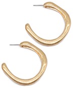 Gold sculpted hoop earrings with an organic, freeform shape