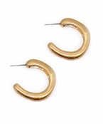 Gold sculpted hoop earrings with an organic, freeform shape