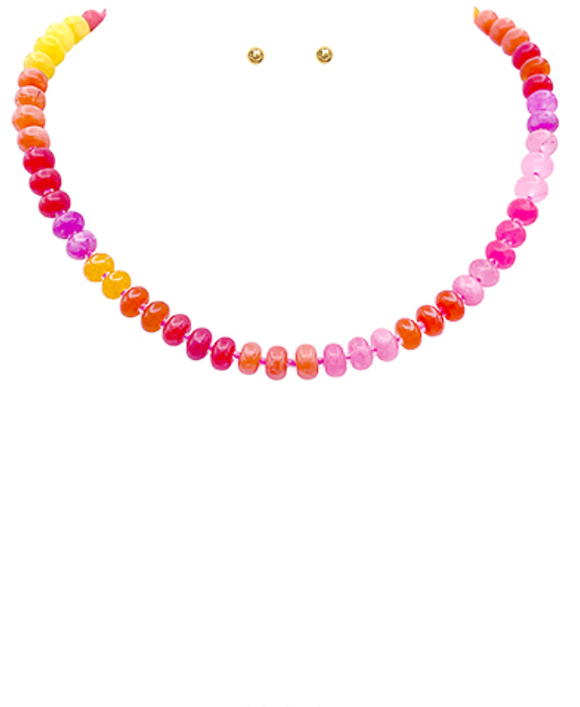 Vibrant Disc Bead Necklace in a rich red color, featuring flat, round disc beads with small gold-toned spacer beads, accompanied by matching stud earrings.