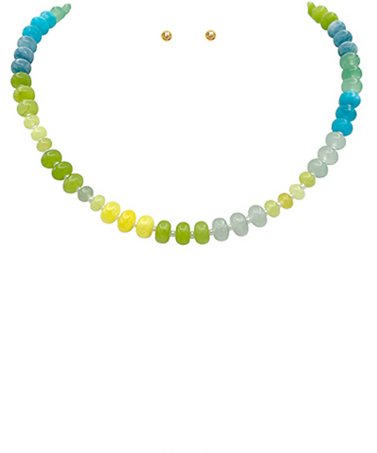 Vibrant Disc Bead Necklace in a refreshing green color, featuring flat, round disc beads with small gold-toned spacer beads, accompanied by matching stud earrings.