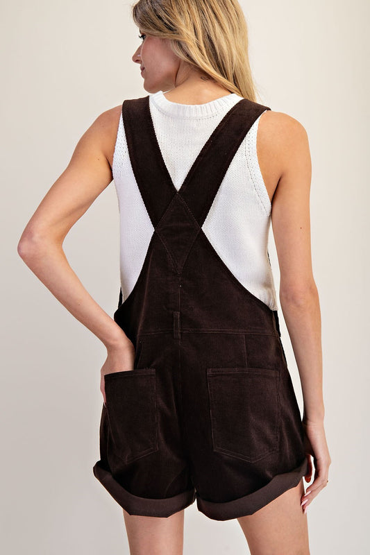 Vintage-inspired corduroy romper with utility details and a flattering retro fit.