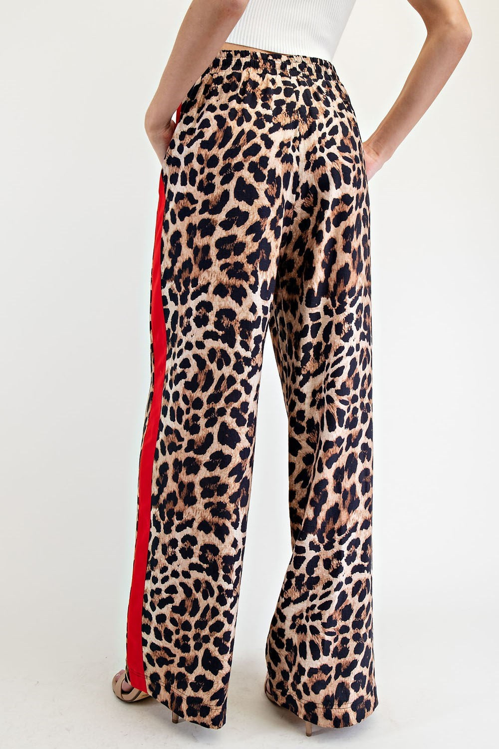 leopard print wide-leg pants with red side stripe.