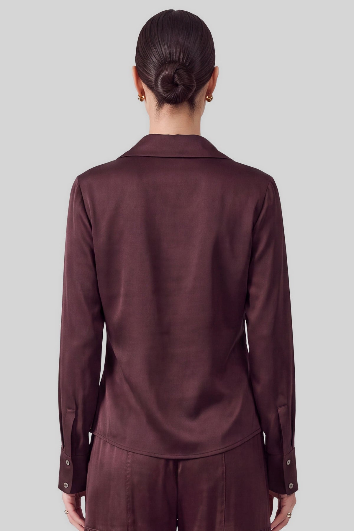 An effortlessly elegant blouse featuring a spread collar with a softly draped cowl neckline and classic long sleeves.