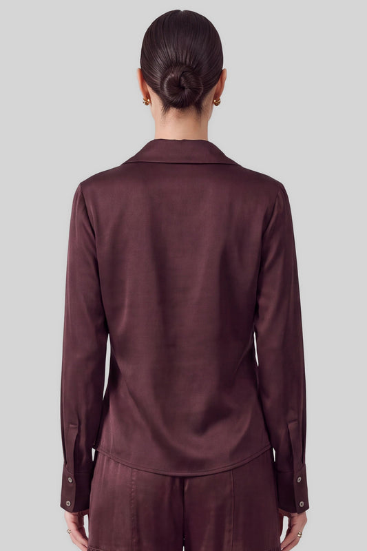 An effortlessly elegant blouse featuring a spread collar with a softly draped cowl neckline and classic long sleeves.