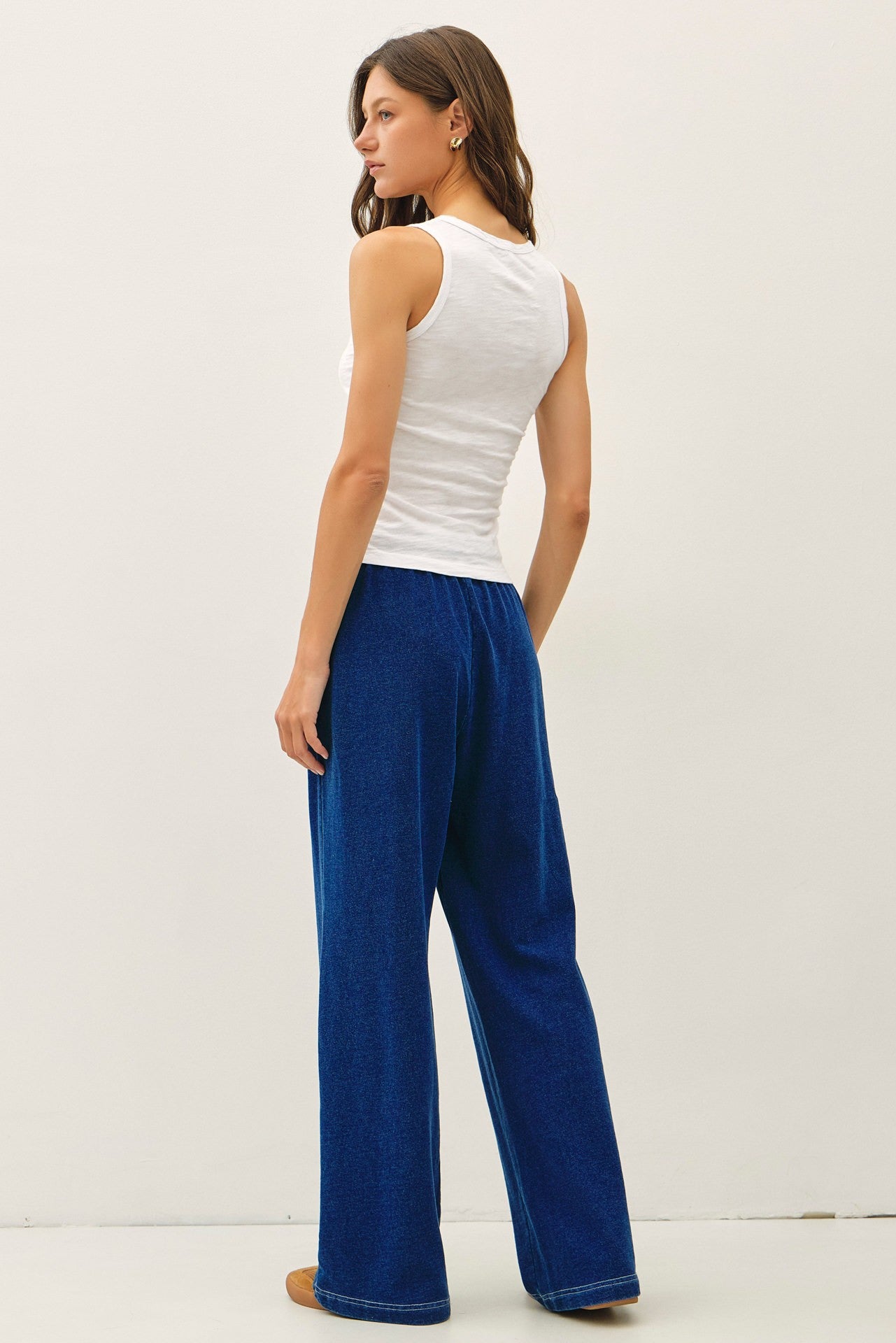 Comfort meets effortless style in these lightweight knit denim wide leg pants featuring an elastic drawstring waist and relaxed lounge fit.