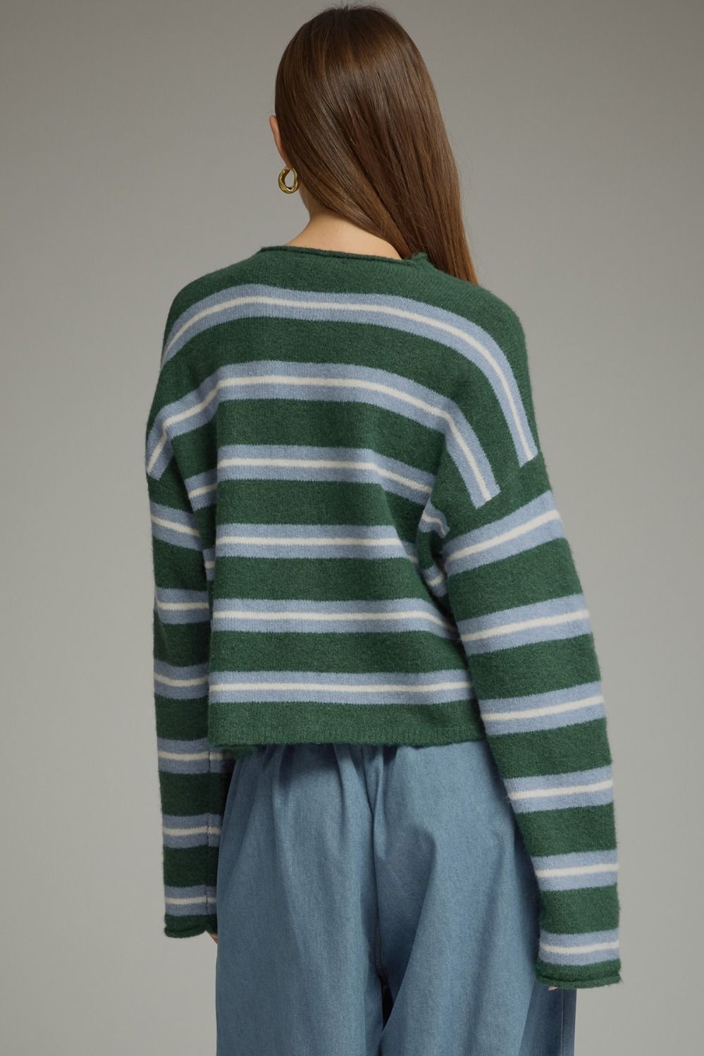 A cozy-chic striped cardigan featuring a classic shirt collar, button-front closure, and soft fuzzy texture for an effortlessly elevated seasonal layer.