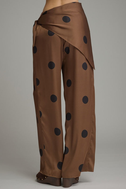 Feminine polka dot wide leg pants featuring a stylish self-tie wrap waist, comfortable elastic back, and convenient side pockets.