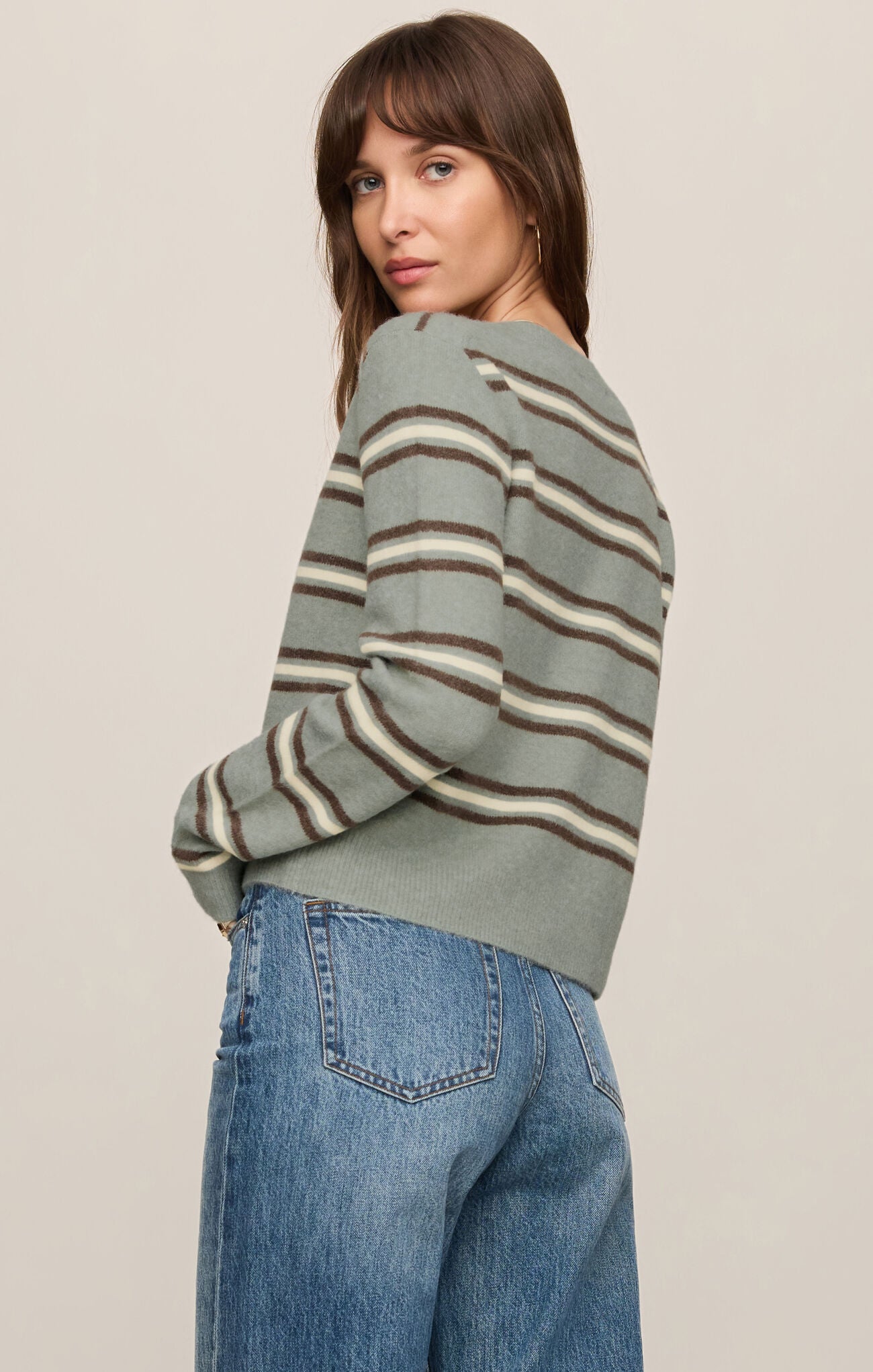 A cozy striped knit top featuring a classic crew neckline, button-front design, and soft stretch fabric for effortless everyday comfort.