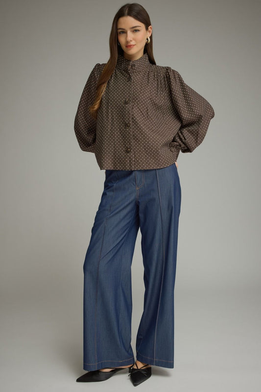 A chic polka dot jacket featuring a polished stand collar, gathered shoulder details, and classic button-front styling in lightweight woven fabric.