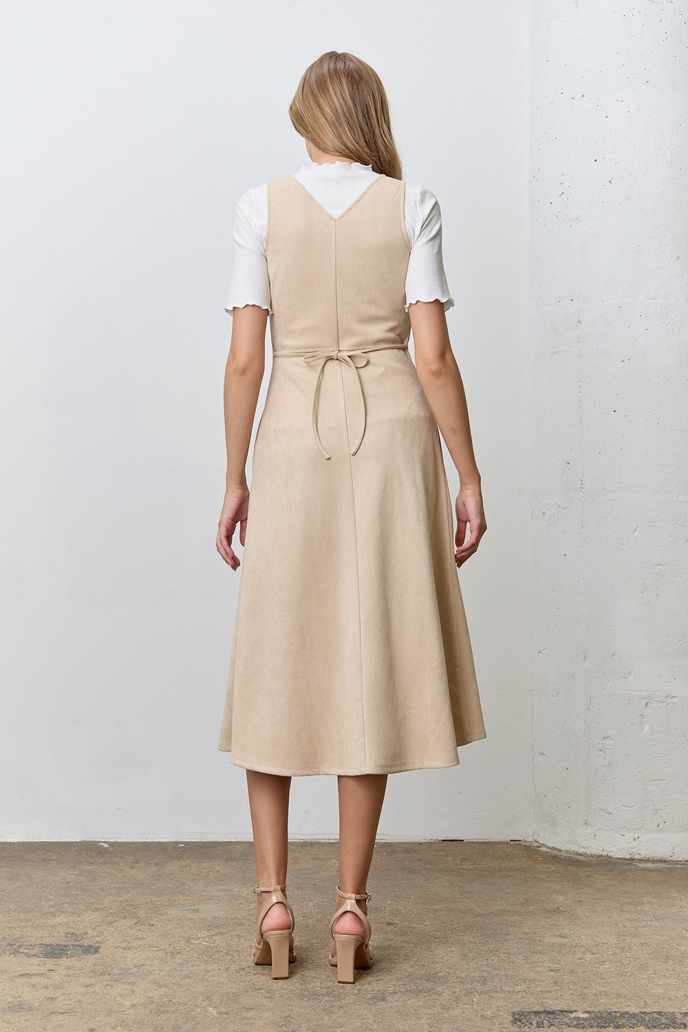 Sleeveless faux suede zip-front midi dress with pockets.