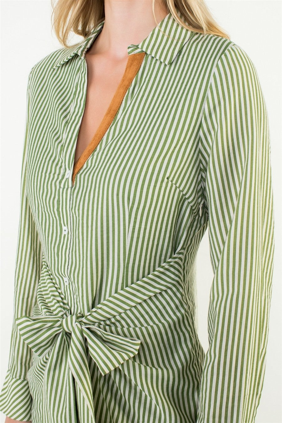 A fresh twist on the classic shirt dress β refined stripes meet a playful front-tie detail for an effortlessly chic silhouette.
