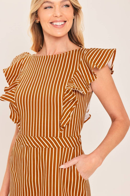 A playful printed skort romper featuring a feminine ruffle sleeve, classic round neckline, and easy back zipper closure for effortless one-and-done style.