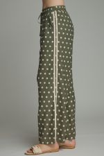 side Playful polka dot pants with a relaxed wide leg silhouette, contrast trim, and an adjustable drawstring waist for effortless everyday style.