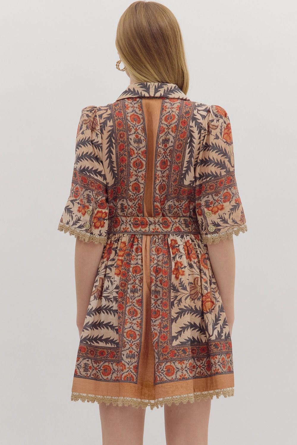 Bold and feminine, the Beatrix mini dress mixes botanical print, contrast trim, and lace accents with a flattering, easy-to-wear silhouette.