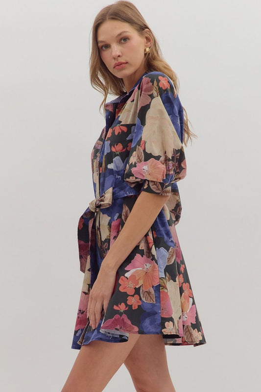 Feminine and functional, the Elowen mini dress features puff sleeves, a self-tie waist, and pockets for effortless charm.