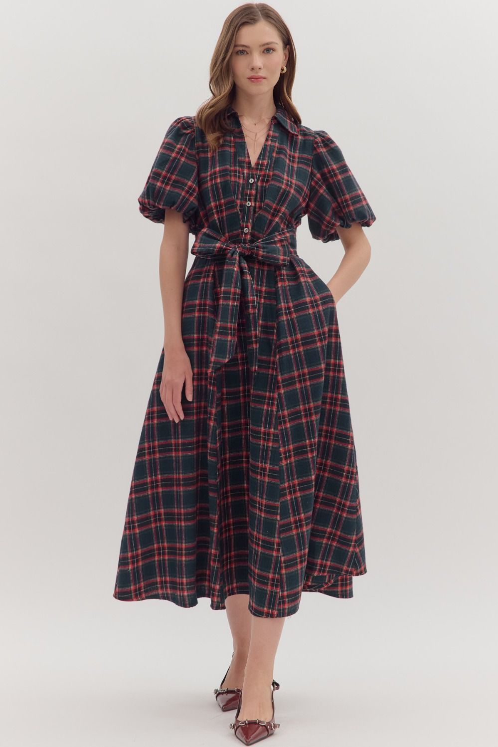 Classic plaid meets modern romance in the Isolde midi dress, complete with puff sleeves, a self-tie belt, and side pockets.