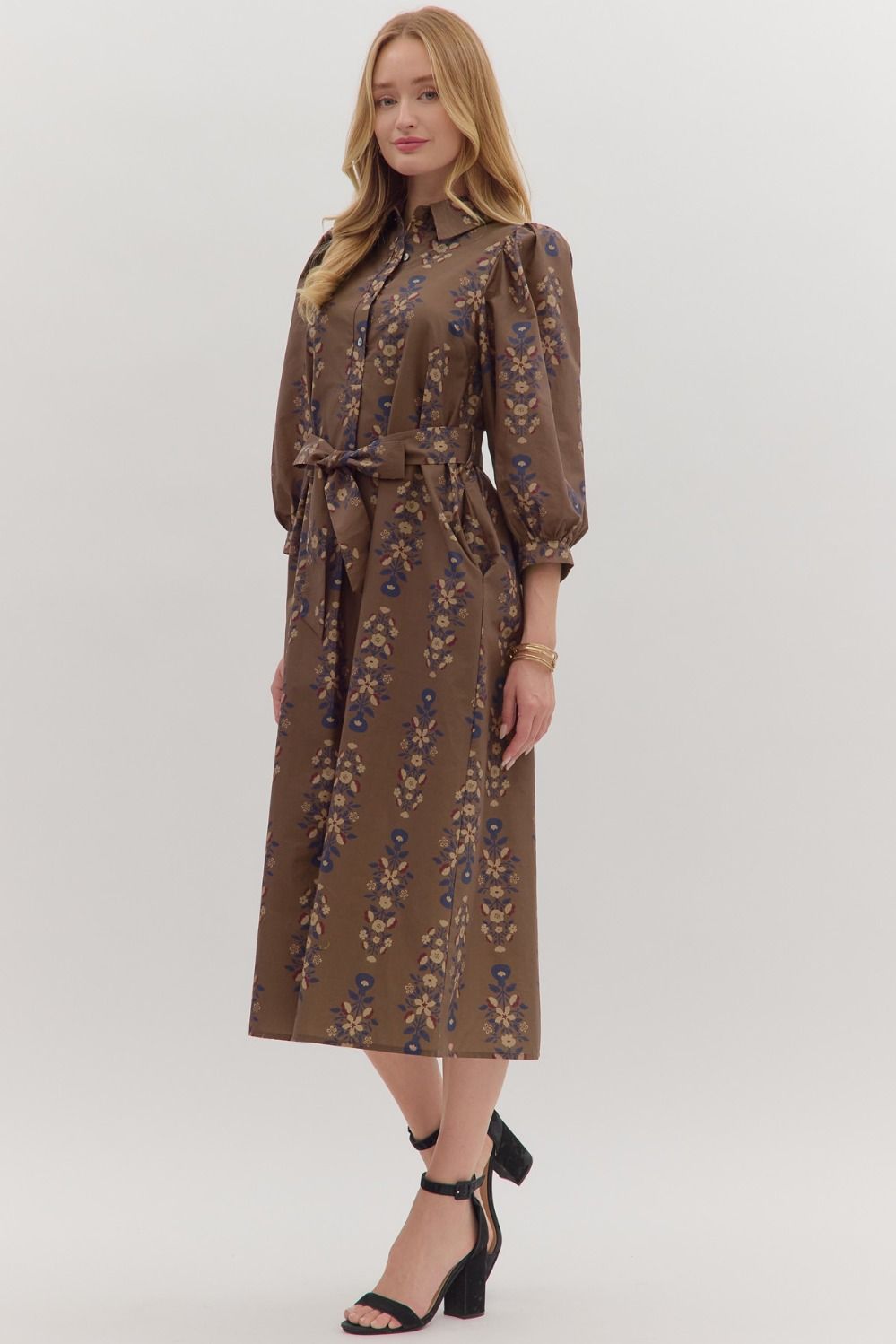 Effortlessly feminine, the Cecily midi dress pairs a botanical print with puff sleeves, a detachable waist tie, and timeless everyday ease.
