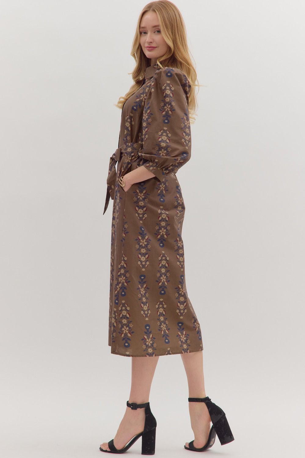 Effortlessly feminine, the Cecily midi dress pairs a botanical print with puff sleeves, a detachable waist tie, and timeless everyday ease.