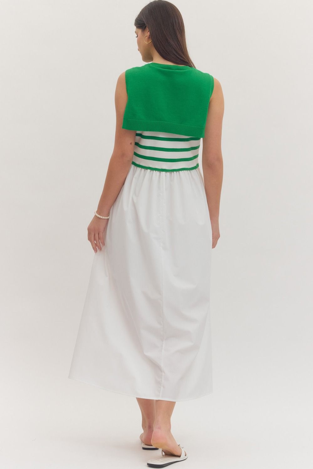 Striped sleeveless midi dress with contrast sweater overlay