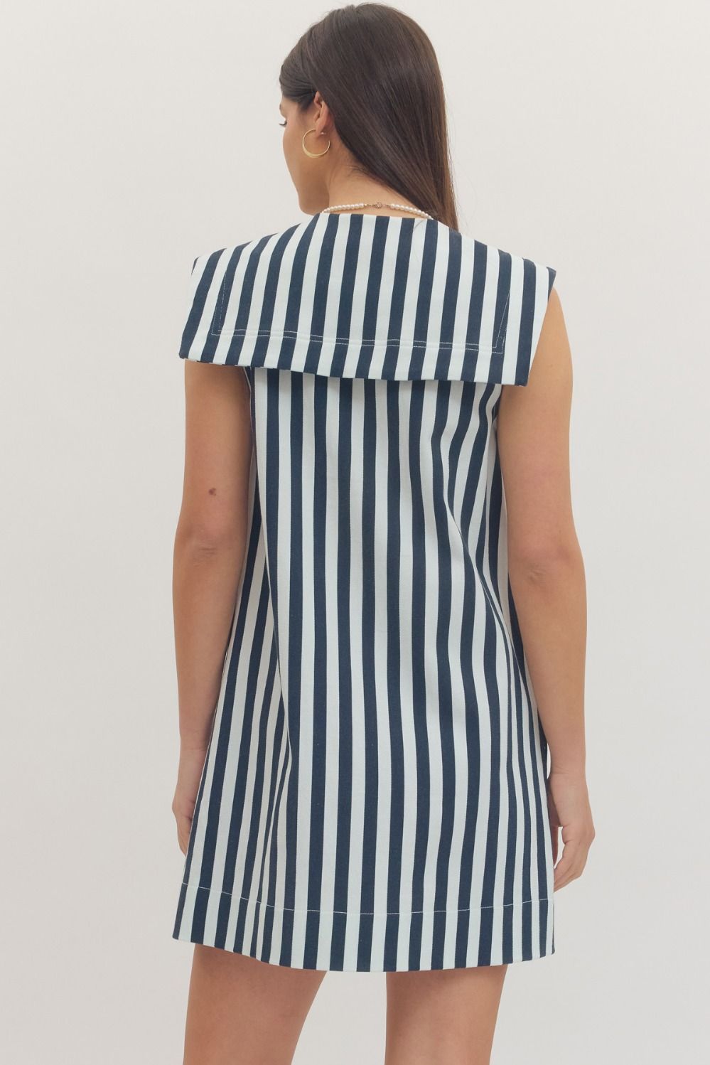 navy and white striped dress with a bow neckline