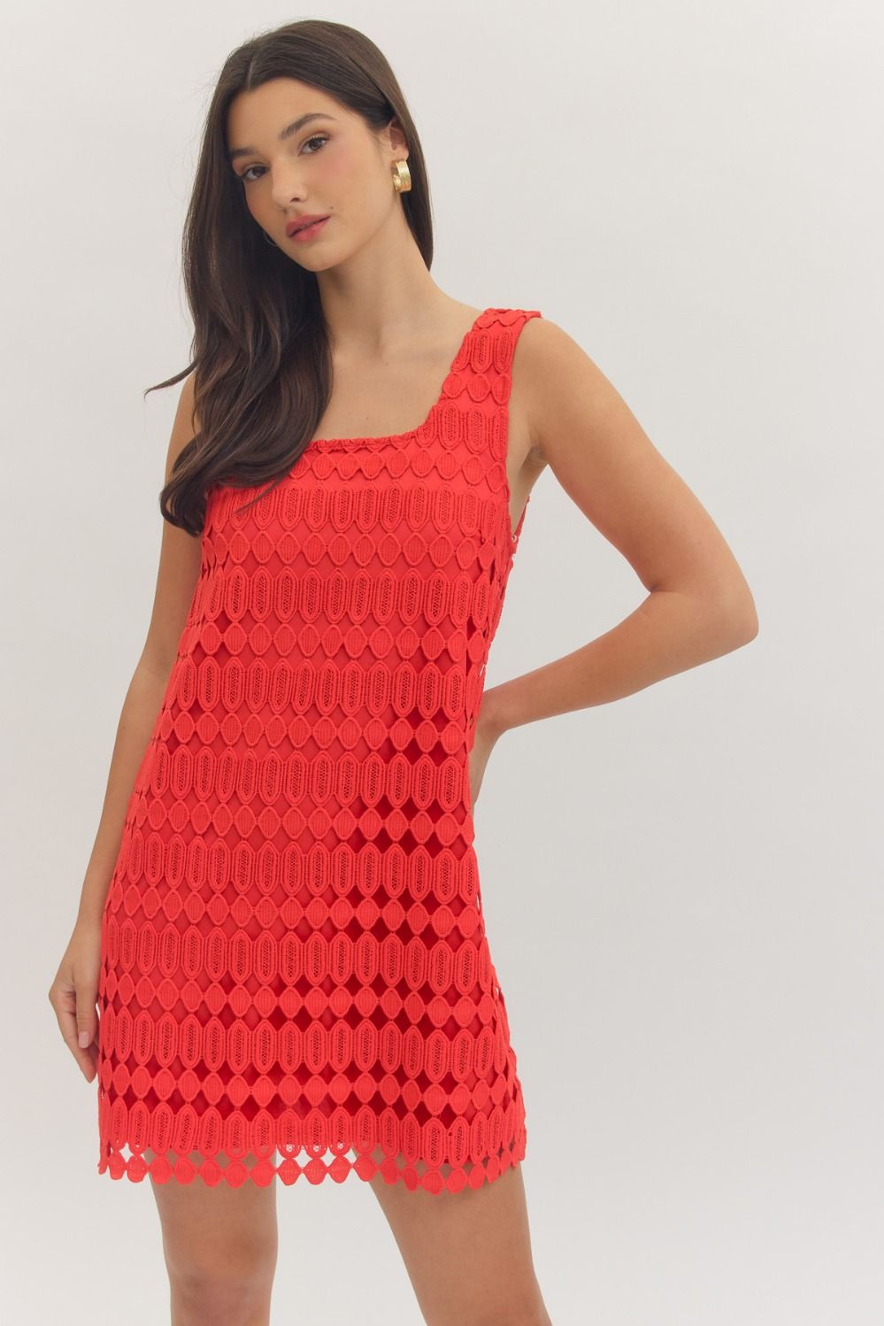 sleeveless mini dress featuring a textured openwork overlay and a modern square neckline