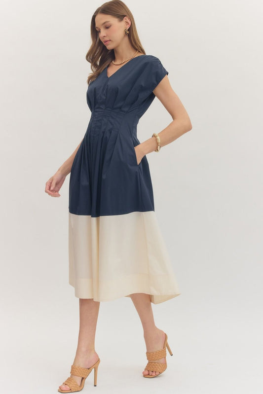 Colorblock Hem Midi Dress features a flattering pleated waist, cap sleeves, and a bold contrast hem