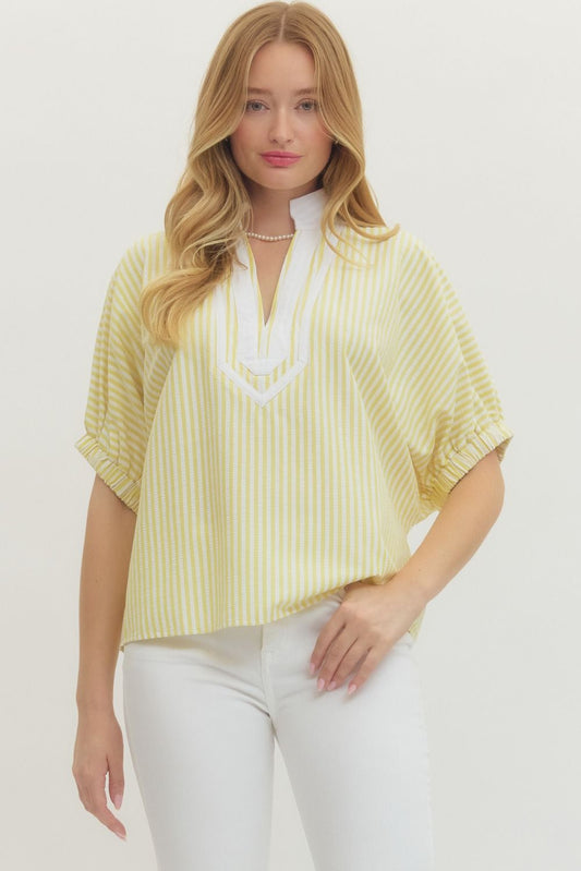 Striped woven top with short dolman sleeves, contrast V-neck panel, and relaxed fit