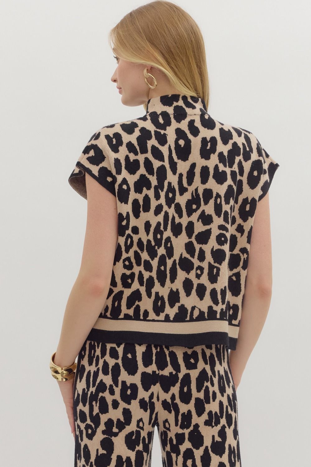 The Liora sweater top blends cozy knit comfort with a chic animal print and polished mock neckline.