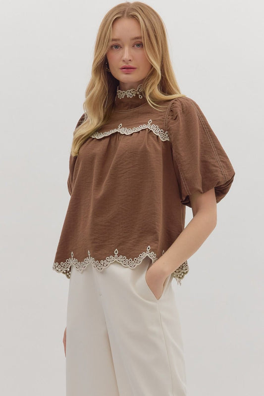 The Isolde top features romantic puff sleeves and scallop embroidered trim for a timeless, feminine finish.